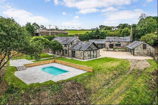 An attractive farmhouse with stunning swimming pool, outbuildings, extensive grounds and r