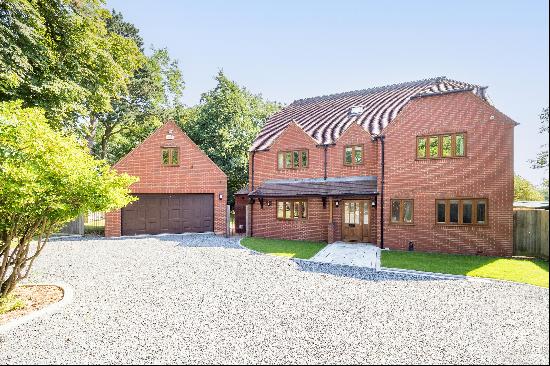 An excellent family home with beautiful views and a detached garage with annexe above.