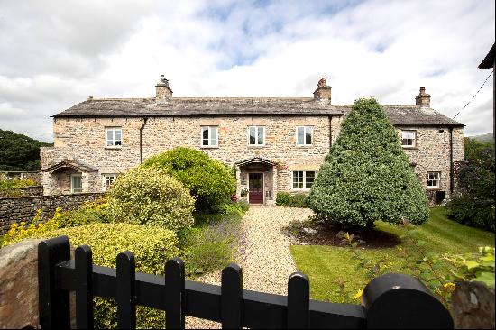 Dating back to the 18th century, a Grade II listed detached former farmhouse with attached