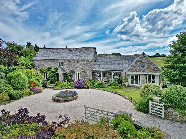 Two stunning and well-appointed detached stonebuilt barns sitting in glorious gardens with