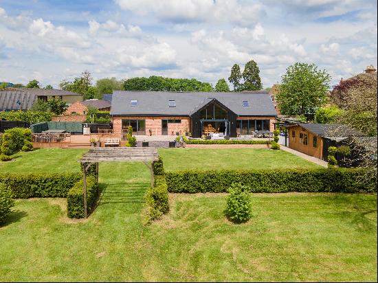 Set in a substantial south facing plot, a stunning contemporary home in the style of a bar