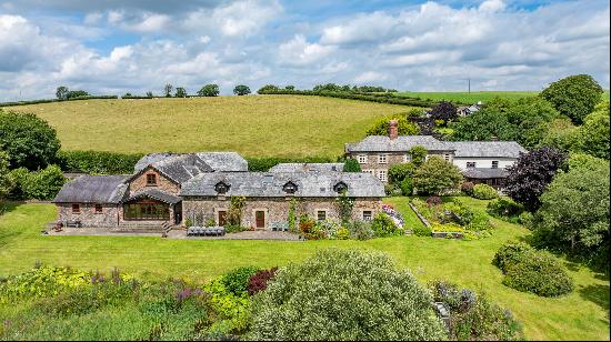 A wonderful country estate comprising a Victorian manor house and two converted barns prov