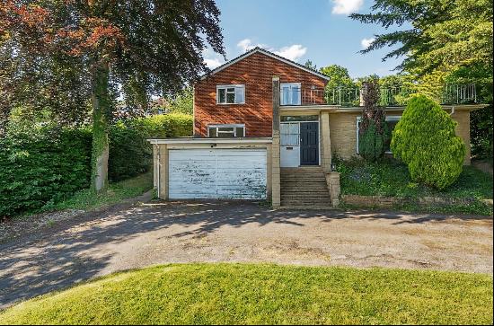 A detached family home situated in a popular residential road offering potential for impro