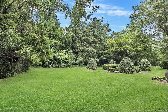 Entertainer's delight! True Locust Valley Charmer. Brick columns and beautiful circular dr