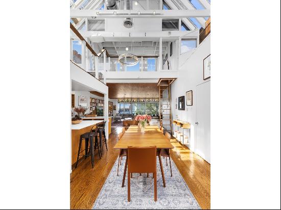 One-of-a-kind two bedroom atop the landmarked Norman Mailer townhouse located on Columb