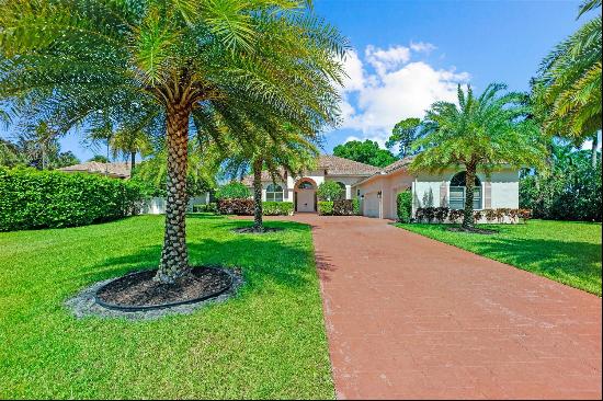 Beautifully renovated and re-designed custom home in West Palm Beach's sought-after gated 