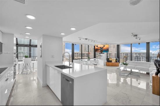 Welcome to refined living on exclusive Brickell Key Island! This 2-bedroom, 2-bathroom cor