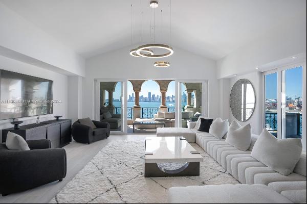 Magnificent Bayview corner unit at private Fisher Island. Beautiful, newly renovated and f