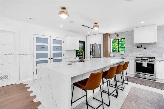 Discover this beautifully renovated 4-bedroom, 4-bathroom home in Fort Lauderdales serene 