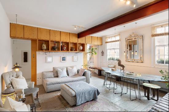 A bright, loft-style top floor apartment in a red-brick mansion block in Chelsea, SW3.