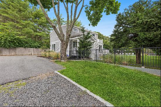 Welcome to 310 Montauk Highway, a delightful sanctuary nestled in the heart of Westhampton