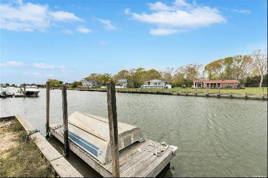 Welcome to your waterfront oasis in Hampton Bays! This charming 3 bedroom, 1.5 bath cottag