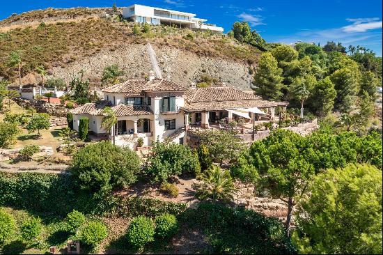 A spacious villa with sweeping views of the nearby mountains, in Marbella Golf Resort.