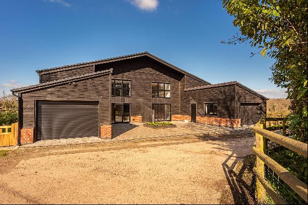 Exceptional four bedroom, barn style new home, with countryside views in Flaunden.