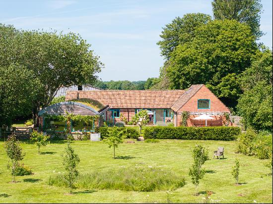 A beautifully converted and well thought out former model farm building situated in a priv