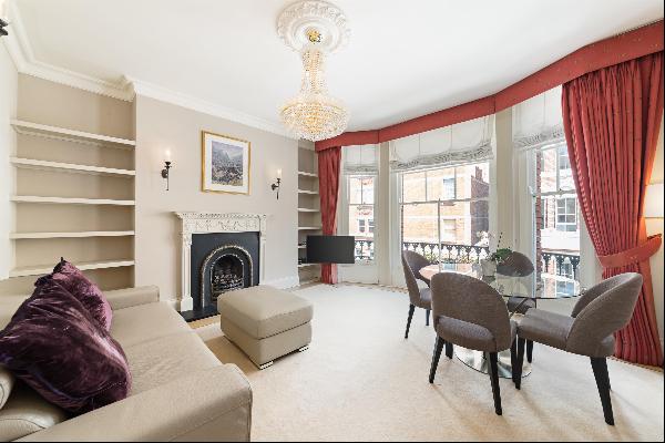 A bright first floor apartment in a sought-after portered mansion block in the heart of Ma