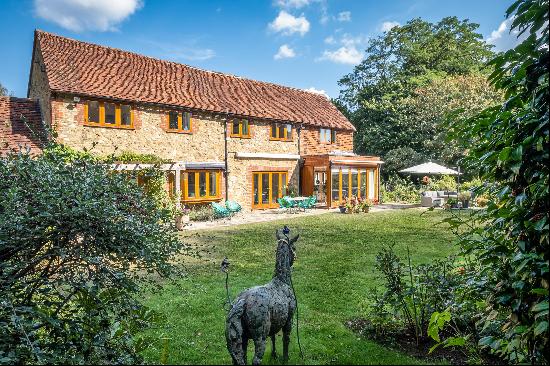 A fabulous village house with superb modern internal spaces and delightful external archit