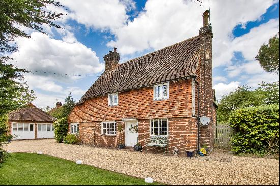 A beautifully presented Grade II listed property with accompanying converted barn set with