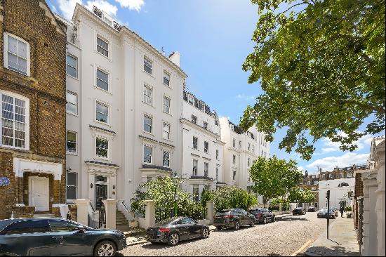 A rare opportunity to acquire a meticulously renovated 1st, 2nd & 3rd floor apartment on t