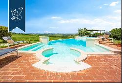 Agritourism with 4 Apartments, Garden with Pool and Olive grove for Sale in Pienza in the 