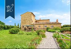 Agritourism with 4 Apartments, Garden with Pool and Olive grove for Sale in Pienza in the 