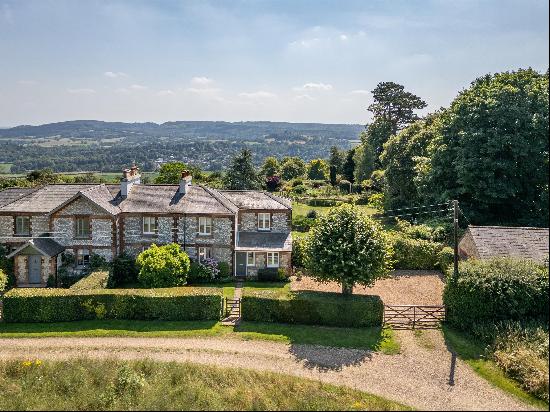 An impressive four bedroom semi-detached house with exceptional views, overlooking the Sur