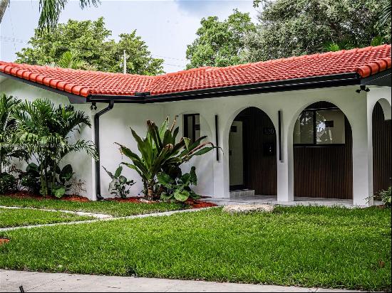 Beautifully renovated corner home in the heart of Miami Shores! This stunning 3-bedroom, 2