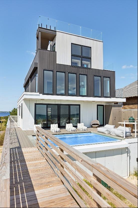 Discover a harmonious blend of luxury and oceanfront living in this striking new construct