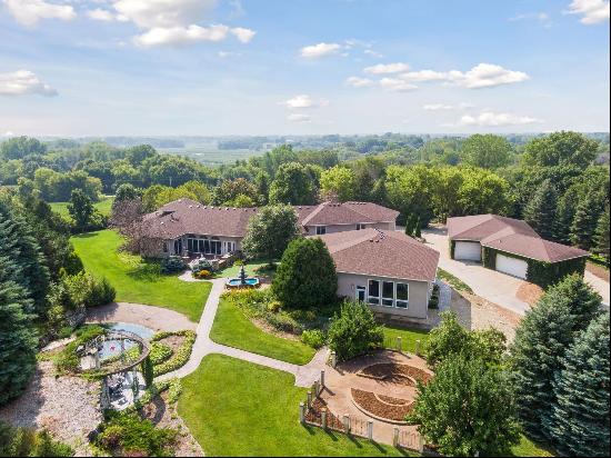 The epitome of luxury and privacy on this breathtaking 10-acre Prior Lake estate