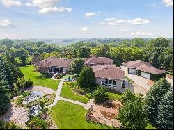 The epitome of luxury and privacy on this breathtaking 10-acre Prior Lake estate