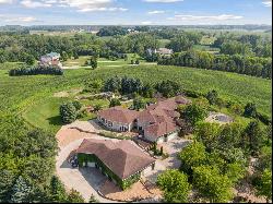 The epitome of luxury and privacy on this breathtaking 10-acre Prior Lake estate