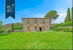 Prestigious renovated farmhouse with outbuilding for sale in the heart of the Crete Senesi