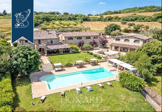 18th-century luxury farmhouse in a rustic chic style with a pool and two outbuildings near