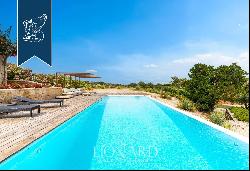 Exclusive estate with a garden and a panoramic pool with a view of Sardinia's coast