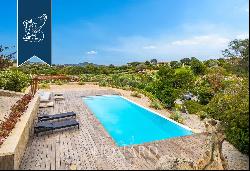 Exclusive estate with a garden and a panoramic pool with a view of Sardinia's coast