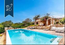 Exclusive estate with a garden and a panoramic pool with a view of Sardinia's coast