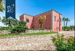 Wonderful renovated farmstead surrounded by olive groves and forests for sale in the Trull