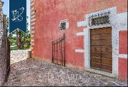 Wonderful renovated farmstead surrounded by olive groves and forests for sale in the Trull