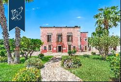 Wonderful renovated farmstead surrounded by olive groves and forests for sale in the Trull