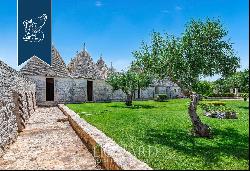 Wonderful renovated farmstead surrounded by olive groves and forests for sale in the Trull