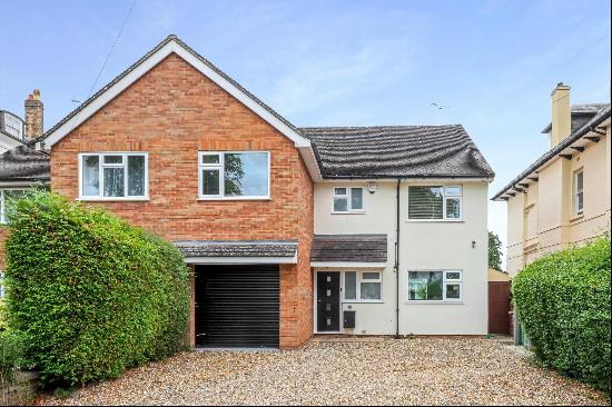 A mature 4 bedroom semi detached town home situated on a leafy avenue with ample off road 