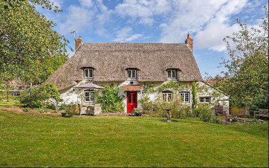 A pretty Grade II listed cottage in the heart of this popular north Hampshire village