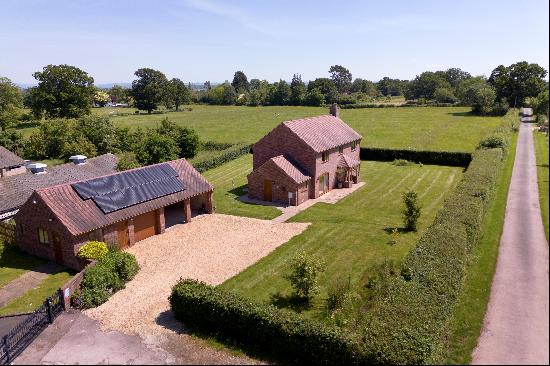 A modern four bedroom detached family home with garaging and a paddock, in all extending t