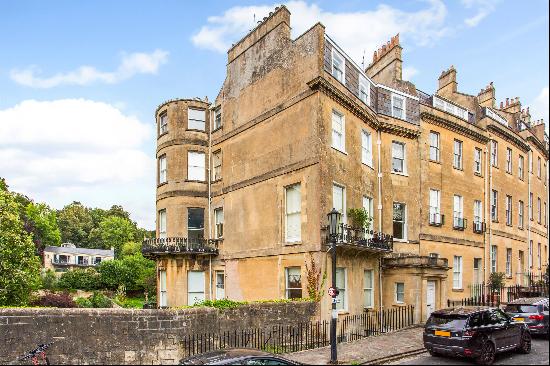 A Grade II listed, three-bedroom, top floor apartment with garden in a prime Bath location