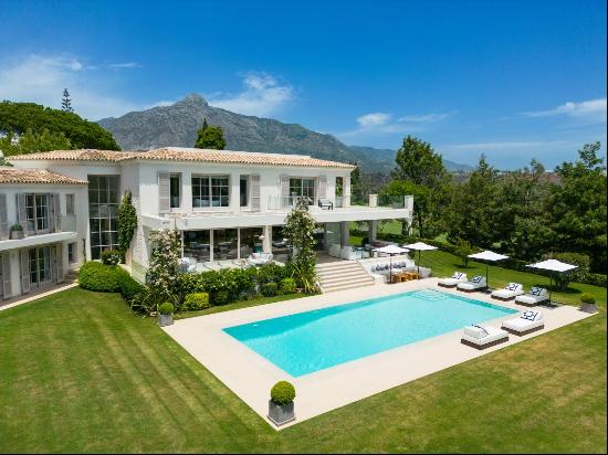 A superb, contemporary villa surrounded by golf courses in a gated community.