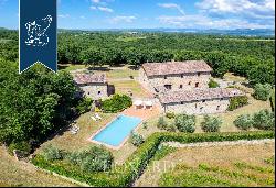 Refined farmhouse with a pool and a private lake for sale near Siena