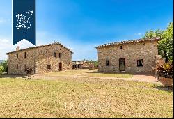 Refined farmhouse with a pool and a private lake for sale near Siena