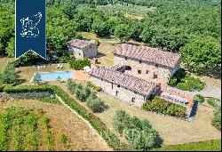 Refined farmhouse with a pool and a private lake for sale near Siena