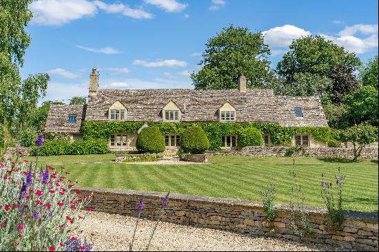 A quintessential Cotswold cottage with an award winning extension and studio annexe set am