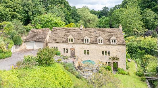 Former working mill set in an idyllic peaceful village location with stunning grounds just